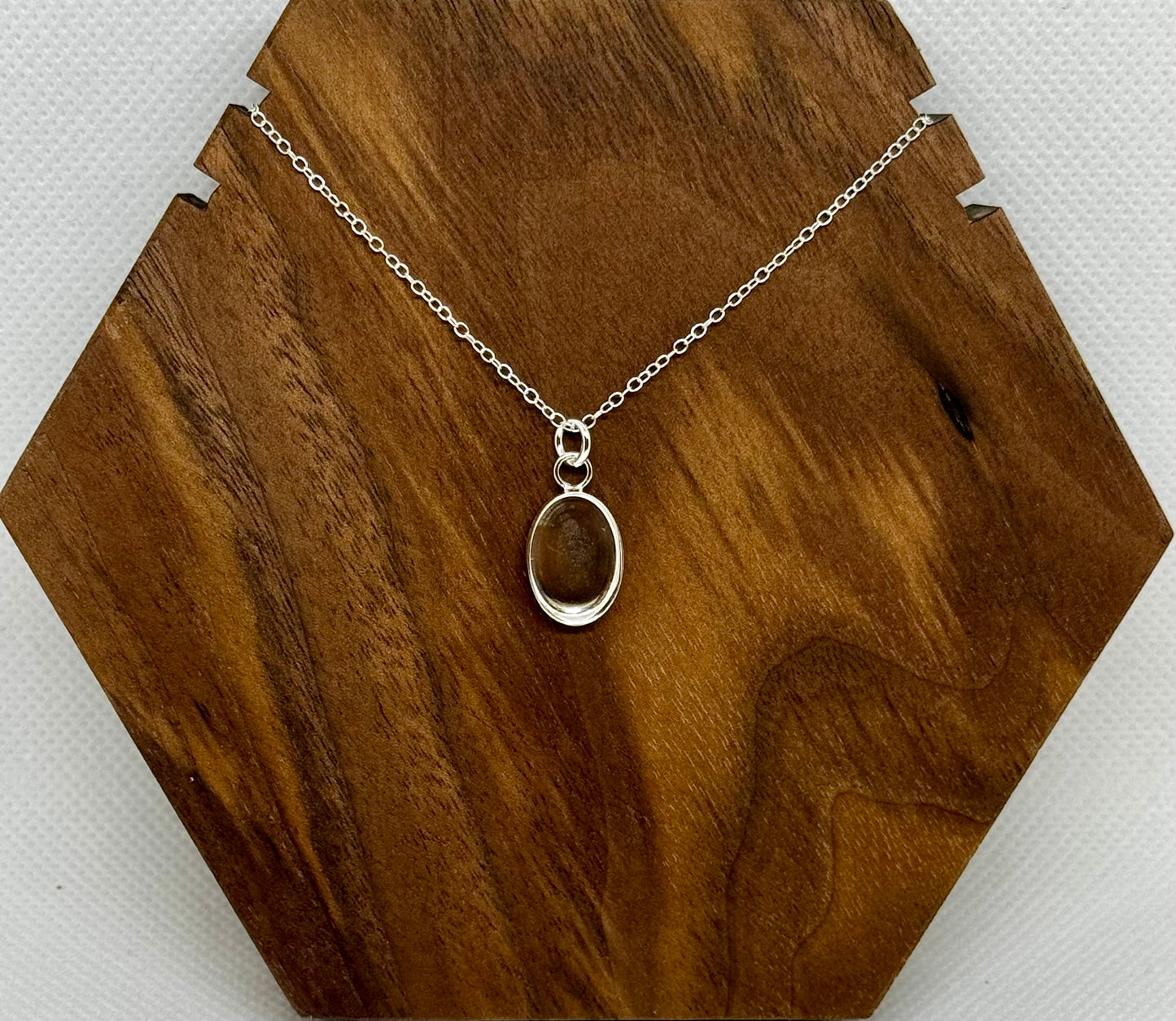 silver circle/oval pendant