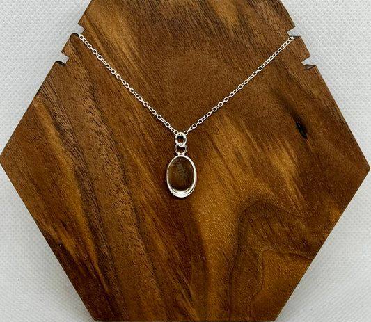 silver circle/oval pendant